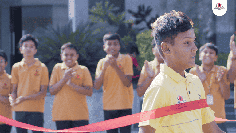  A student crossing the finish line at a school event, perfect for college promo video production showcasing student success